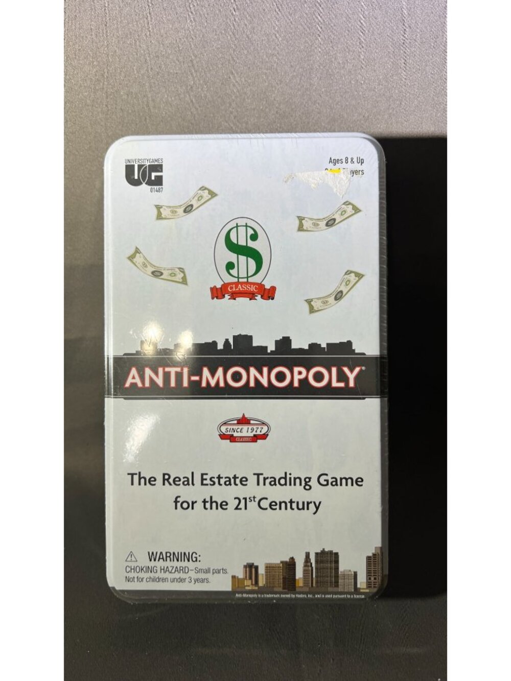 Anti-Monopoly Real Estate Game Tin Box Ages 8+ 2-6 Players